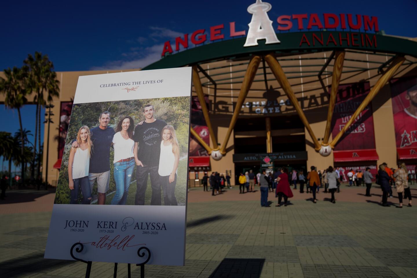 People wait outside the gates before the start of a celebration of life ceremony at Angel Stadium on Monday.