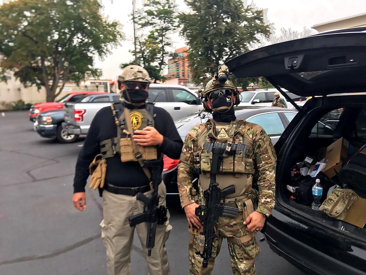 Two members of the Oath Keepers in Louisville, Ky., this year.
