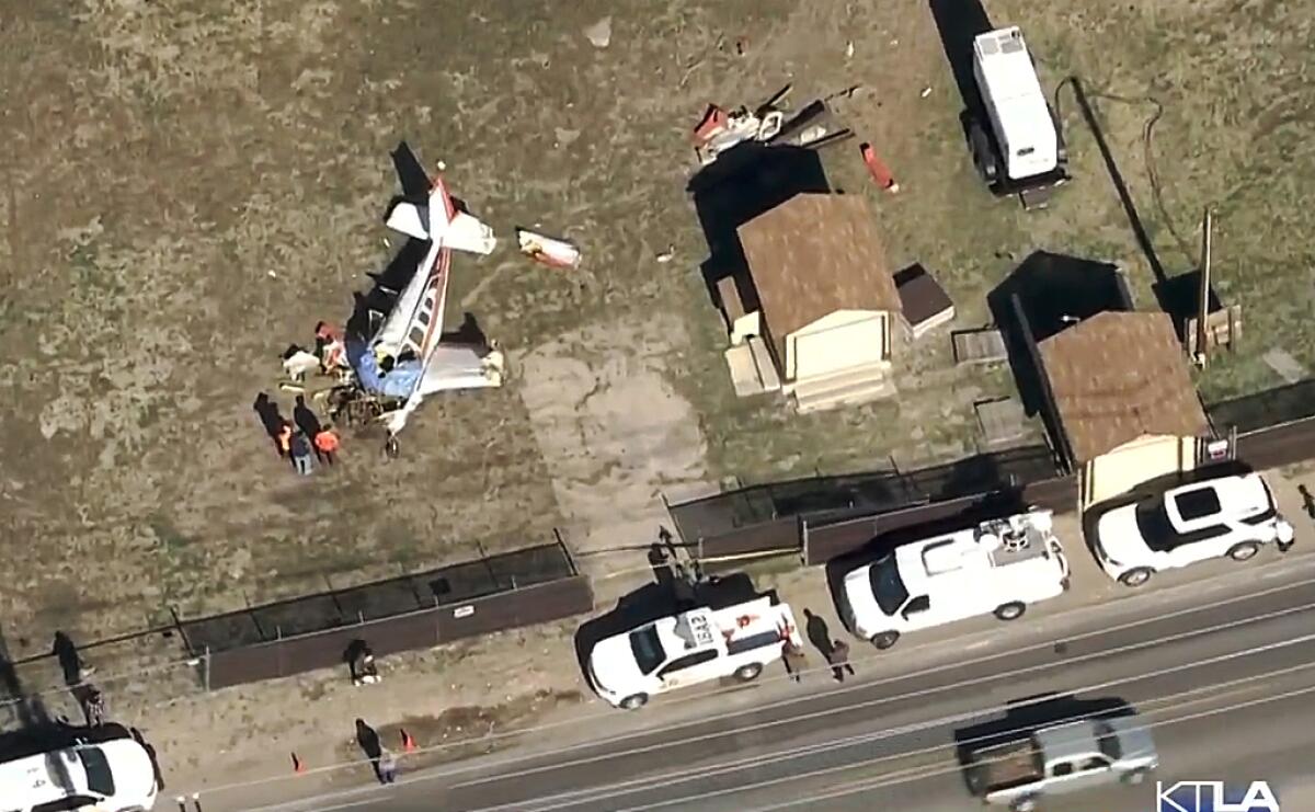 An aerial view of a small plane that crashed into a field.