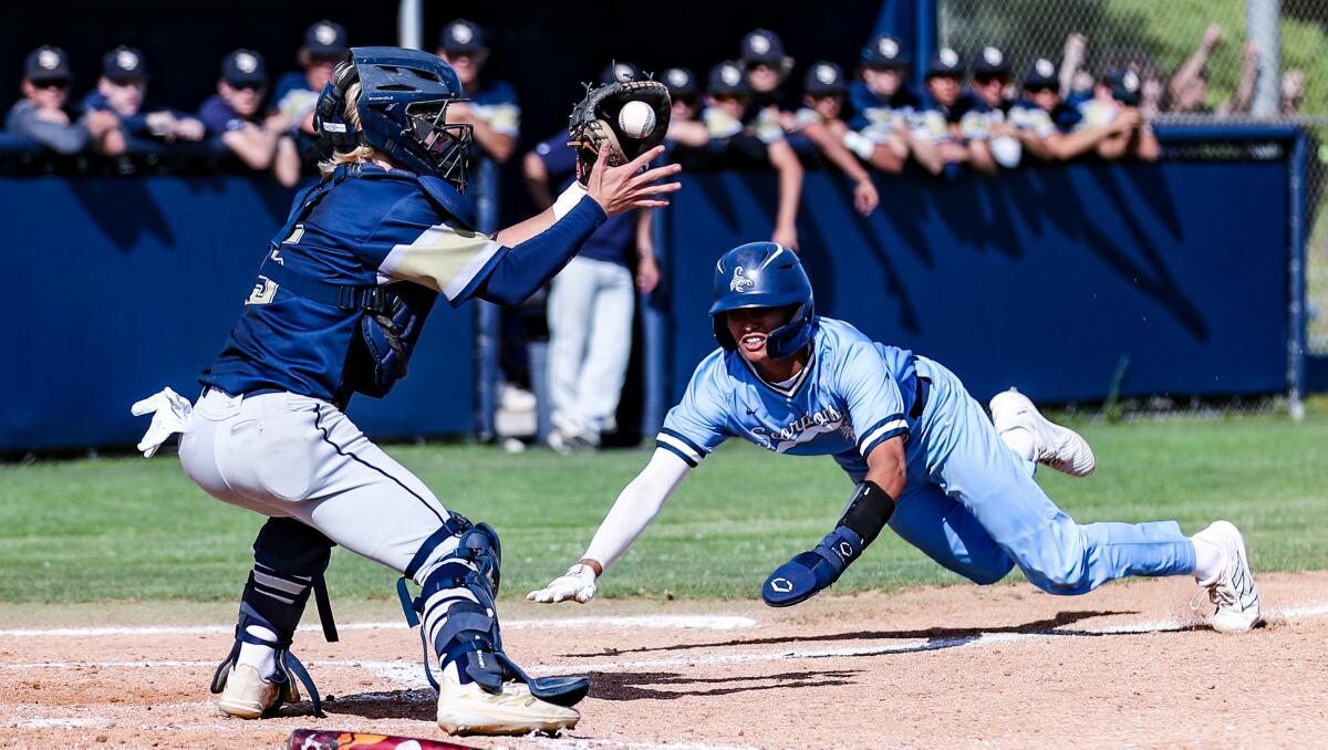 Troy Arenzana of Camarillo slides home 