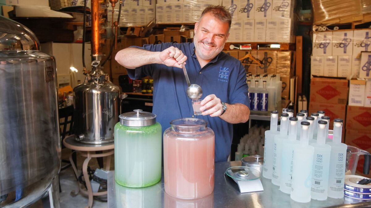 Owner Nick Apostolopoulos serves up 619 Rose Petal Vodka at 619 Spirits Distillery and Tasting Room.