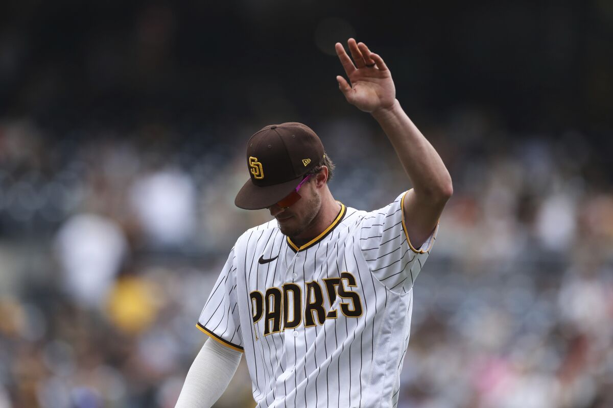 San Diego Padres' Wil Myers waves to the crowd after being removed from the team's baseball game against the San Francisco Giants during the eighth inning Wednesday, Oct. 5, 2022, in San Diego. (AP Photo/Derrick Tuskan)