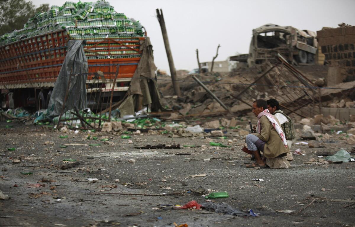 Shiite Muslim Houthi fighters guard the site of airstrikes carried out in Sana, Yemen, carried out by a coalition led by Saudi Arabia. Yemen has become a focus of the rivalry between Saudi Arabia and Iran.