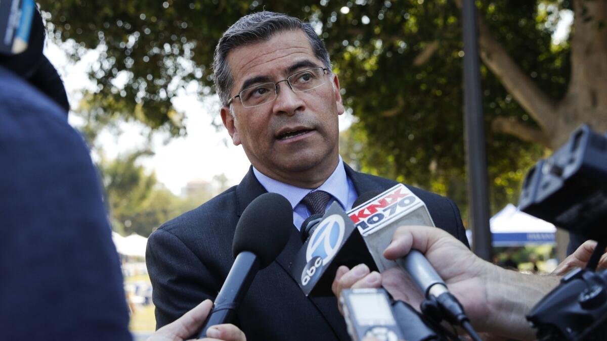 California Atty. Gen. Xavier Becerra, shown in August, agreed Friday to put the state's new net neutrality law on hold until after a decision by a federal appeals court on whether the Trump administration acted lawfully in ending regulation of internet providers.