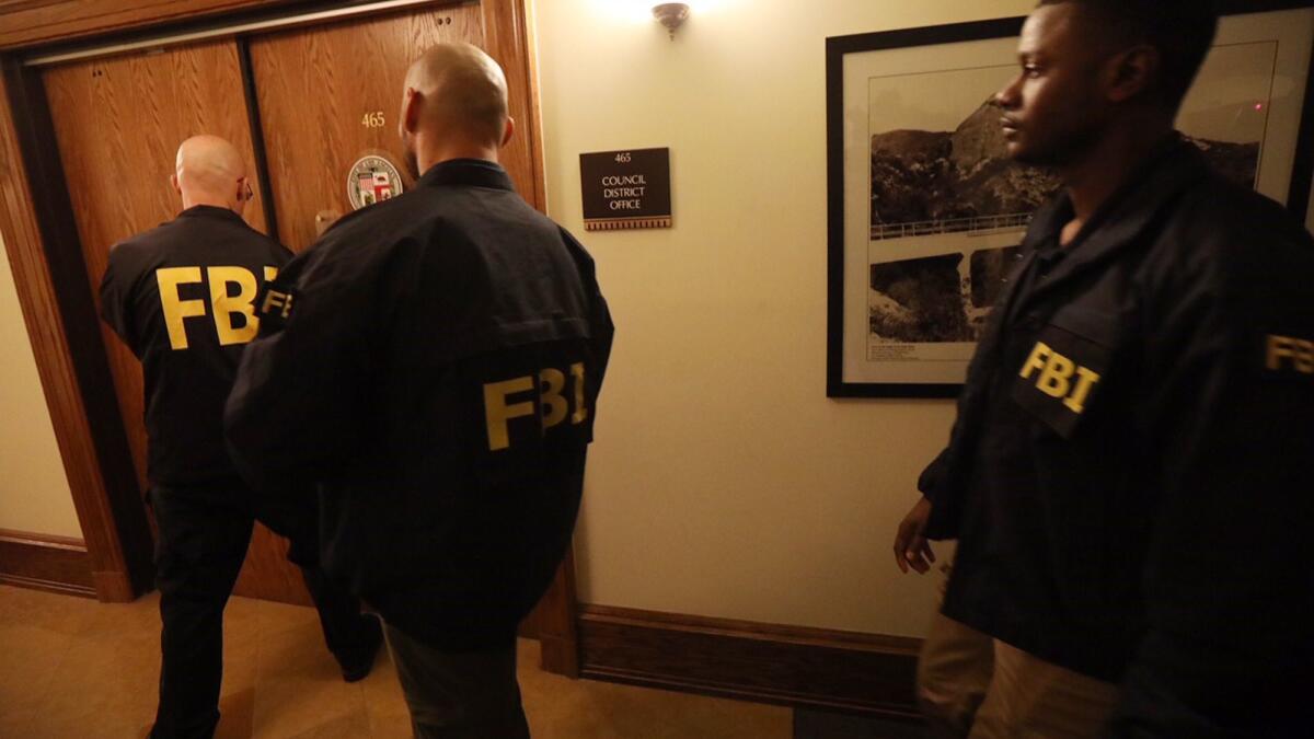 FBI agents execute a search warrant Wednesday at the City Hall office of Councilman Jose Huizar in downtown Los Angeles.