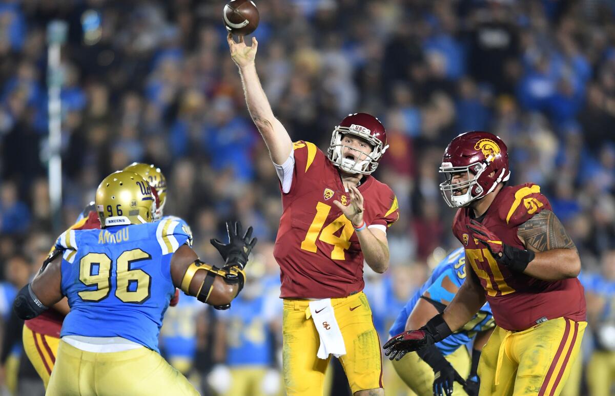 USC quarterback Sam Darnold gets a pass off against UCLA in the second quarter at the Rose Bowl on Saturday.