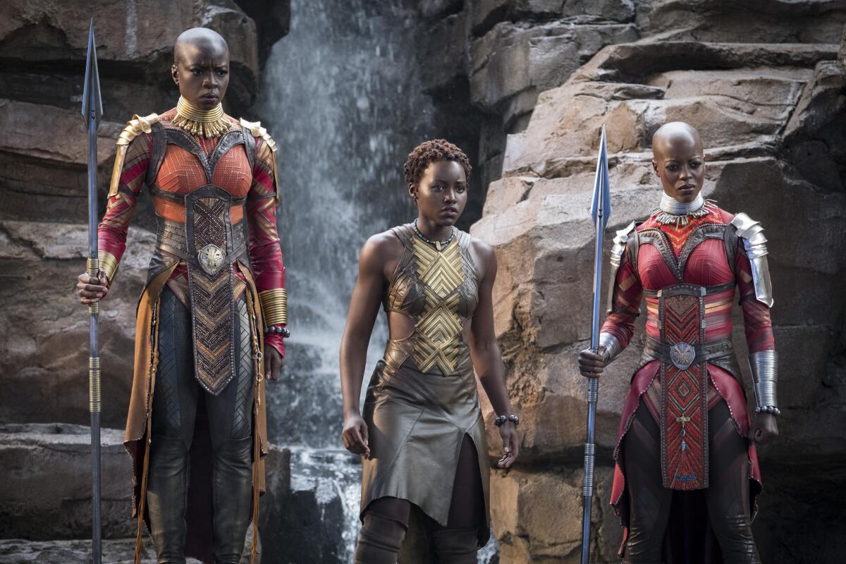 Danai Gurira, Lupita Nyong'o and Florence Kasumba in a scene from "Black Panther."