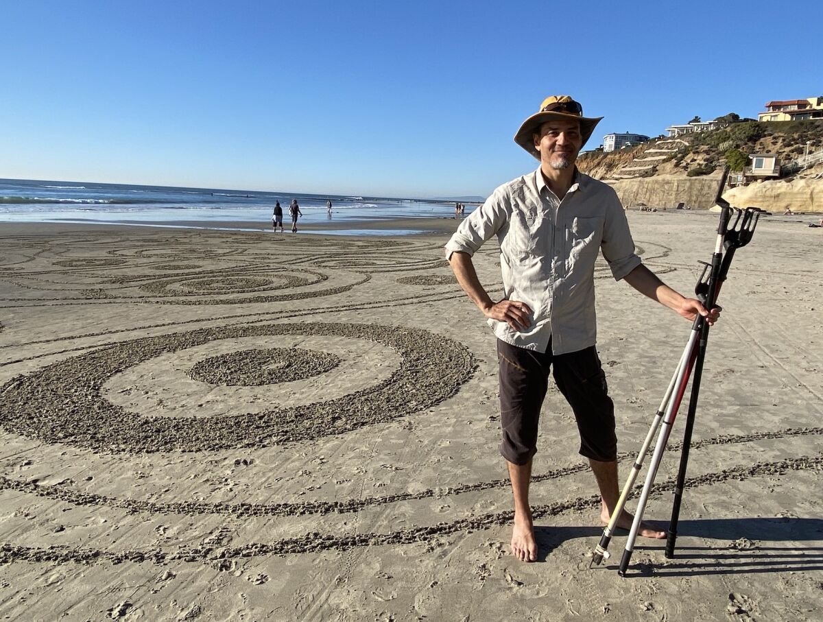 Portrait of artist Andres Amador with some of his tools.