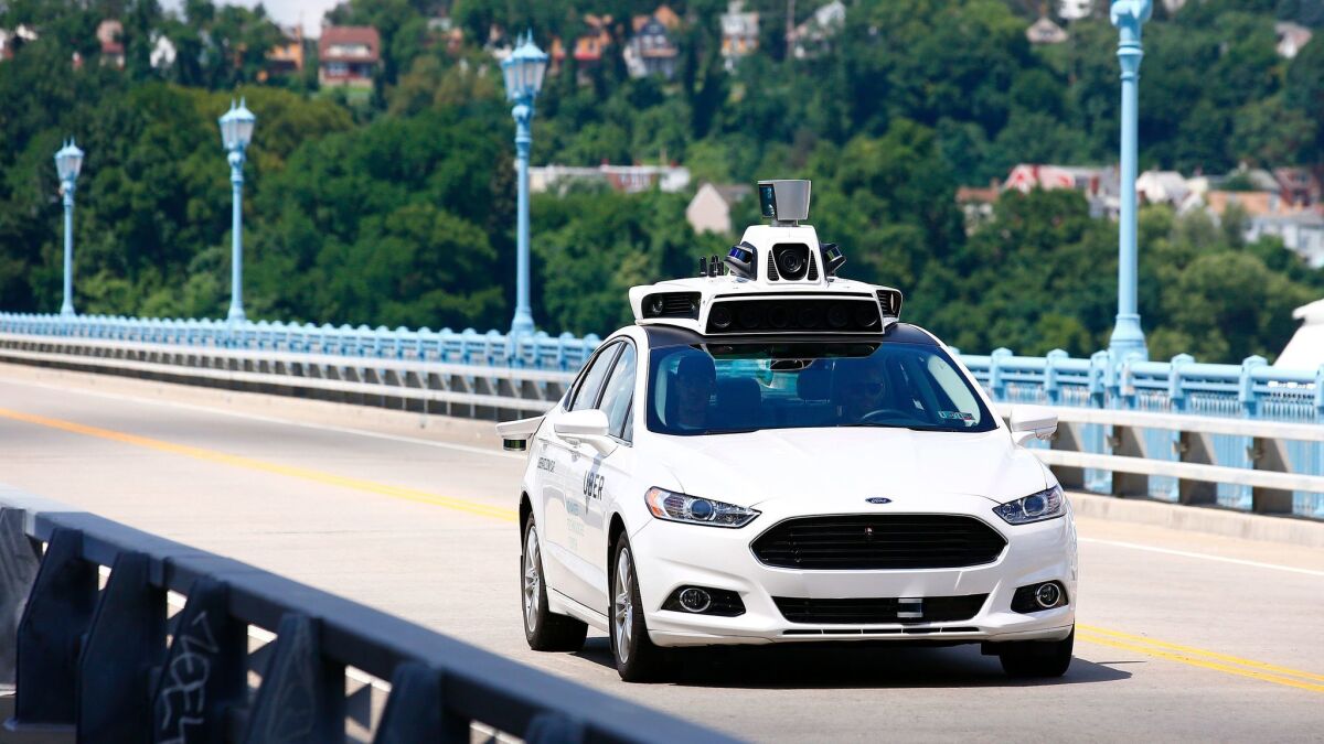 An autonomous Uber test car on a bridge in Pittsburgh.