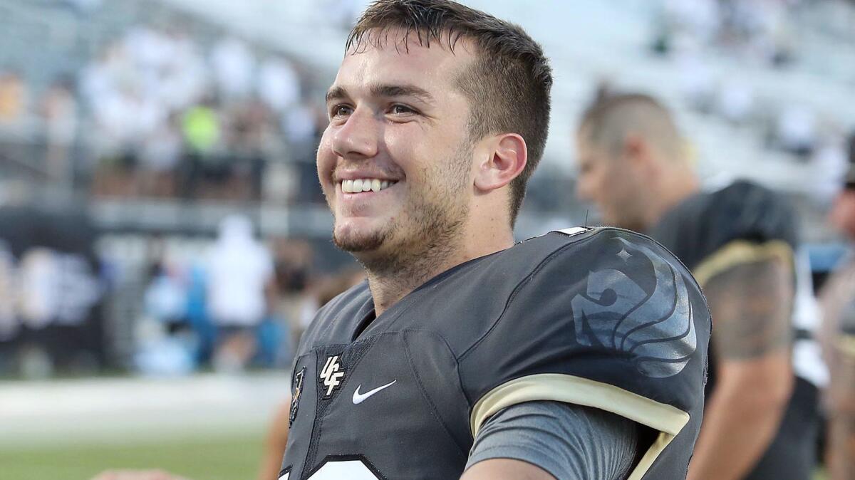 Central Florida quarterback McKenzie Milton enjoys the moment after a 45-14 win against Pittsburgh at Spectrum Stadium in Orlando, Fla., on Saturday.
