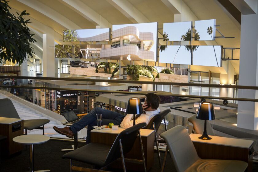 Travelers awaiting flights can relax at the Star Alliance lounge with a view of the Bradley International Terminal concourse and its many video screens.
