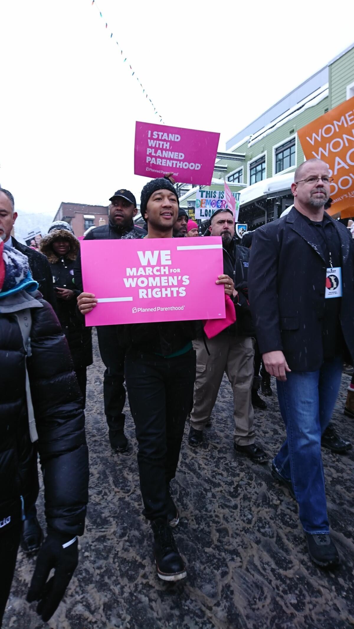 John Legend (and security) at the women's march.