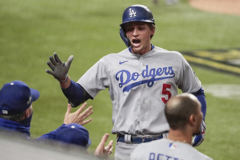 Arlington, Texas, Friday, October 16, 2020. Los Angeles Dodgers shortstop Corey Seager (5) homers.