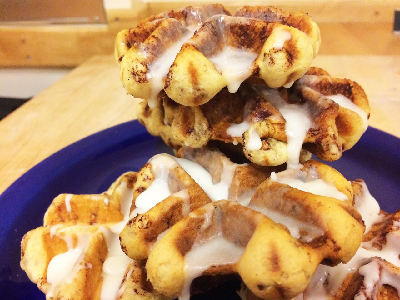 A plate of cinnamon roll waffles.