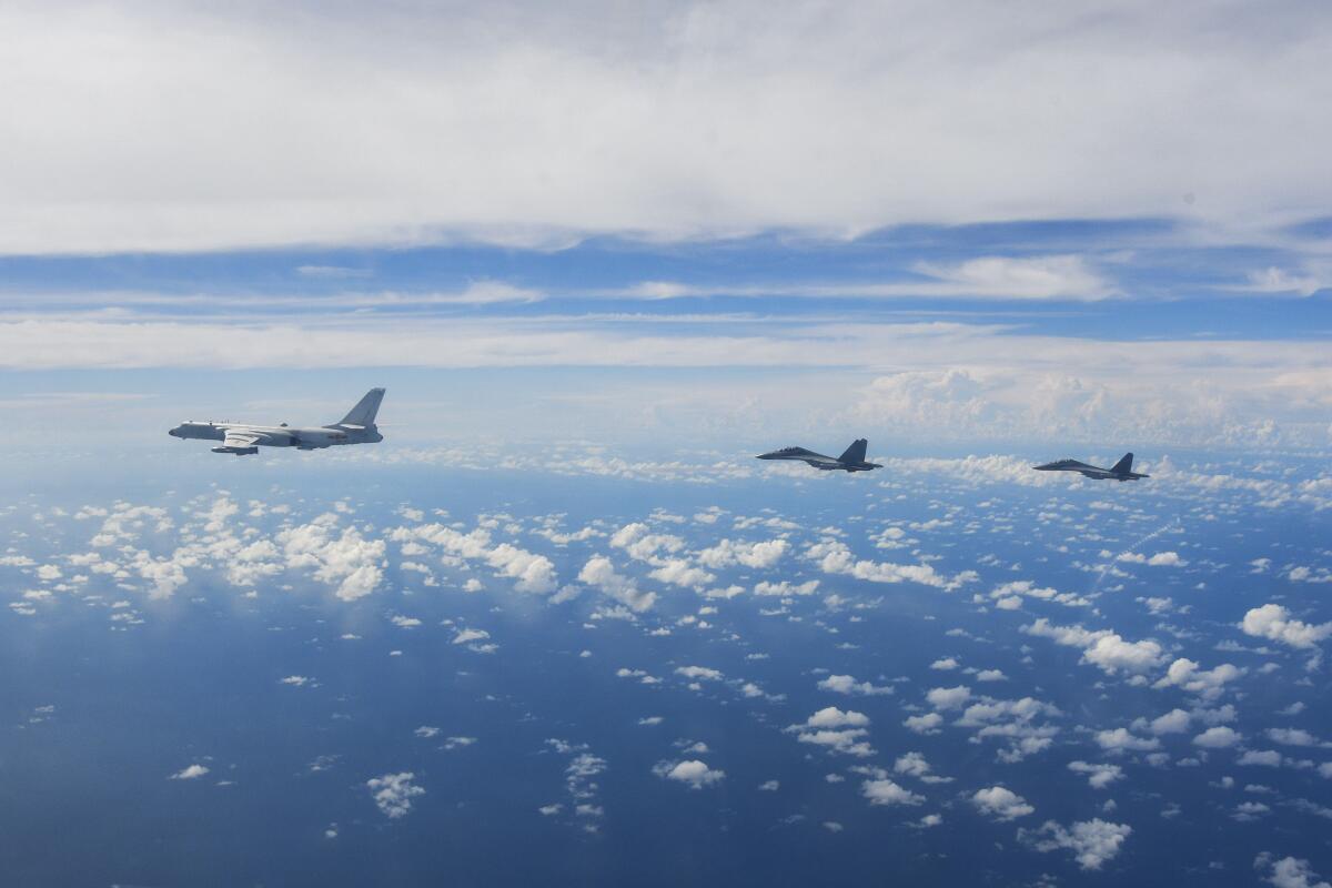 FILE - In this photo released by Xinhua News Agency, aircraft of the Eastern Theater Command of the Chinese People's Liberation Army (PLA) conduct a joint combat training exercises around the Taiwan Island on Sunday, Aug. 7, 2022. China on Thursday, Aug. 11, 2022, renewed its threat to attack Taiwan following almost a week of wargames near the island. (Li Bingyu/Xinhua via AP, File)