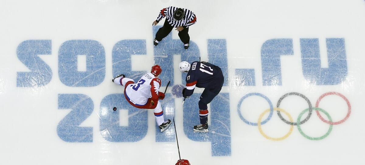 Russia center Pavel Datsyuk, left, and U.S. center Ryan Kesler face off during a game at the 2014 Winter Olympics.