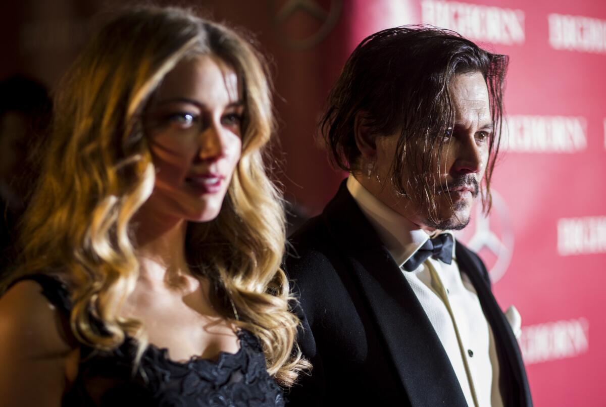 Actors Johnny Depp and Amber Heard arrive at the red carpet of the 2015 Palm Springs International Film Festival Awards Gala on Jan. 2, 2016.