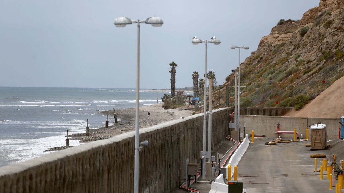 A view of the 27-foot sea wall with San Onofre State Beach in the background at the decommissioned San Onofre Nuclear Generating Station in May 2017.