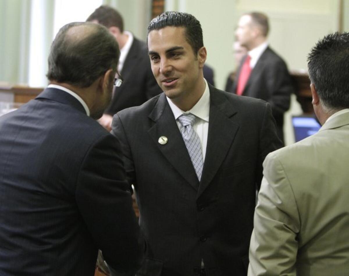 Mike Gatto (D-Silver Lake)receives congratulations after he was sworn in to the Assembly in 2010.