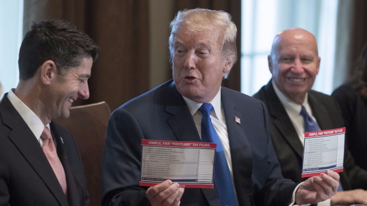 President Trump, flanked by House Speaker Paul Ryan (R-Wis.), left, and House Way and Means Committee Chairman Kevin Brady (R-Texas), celebrates the unveiling of a GOP tax plan that would mostly benefit families like his.