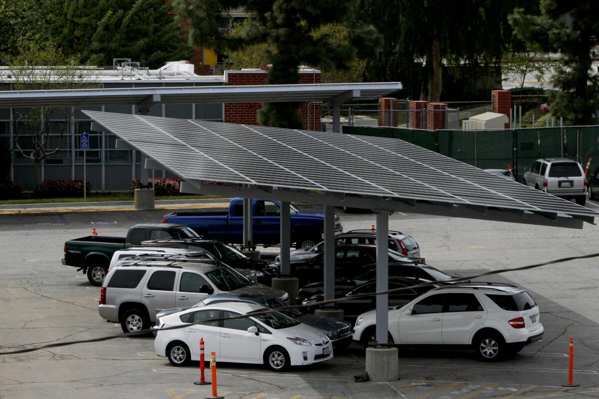A new government-run energy program approved by L.A. County supervisors would include solar projects like this parking canopy at Taft High in Woodland Hills.