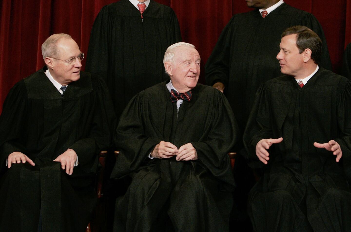 WASHINGTON - MARCH 03: ( L to R), Justice Anthony M. Kennedy, Justice John Paul Stevens, Chief Justice John G. Roberts chat during a photo seesion with photographers at the U.S. Supreme Court March 3, 2006 in Washington DC. (Photo by Mark Wilson/Getty Images)