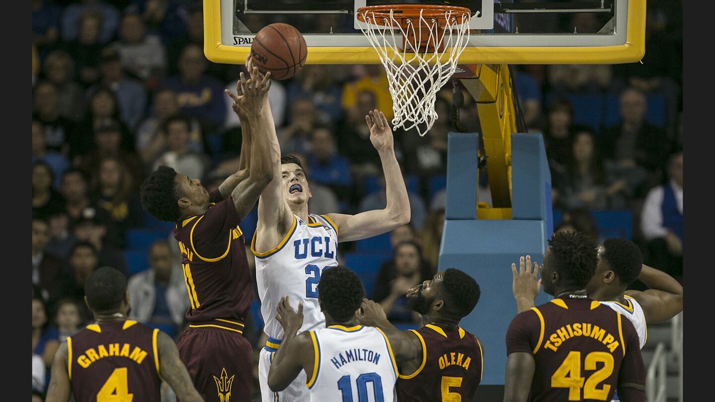 Bruins forward TJ Leaf battles for a rebound with Sun Devils guard Shannon Evans during the first half at Pauley Pavilion.