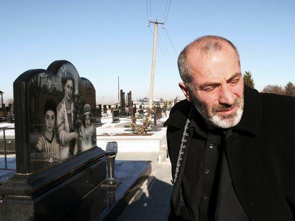 Vitaly Kaloyev visits the gravesite of his wife and two children in his hometown of Vladikavkaz in southern Russia. After his family was killed in a plane crash in 2002, he traveled to Switzerland intent on confronting the air traffic controller who was on duty and ended up stabbing him to death. He says he has no recollection of the assault.