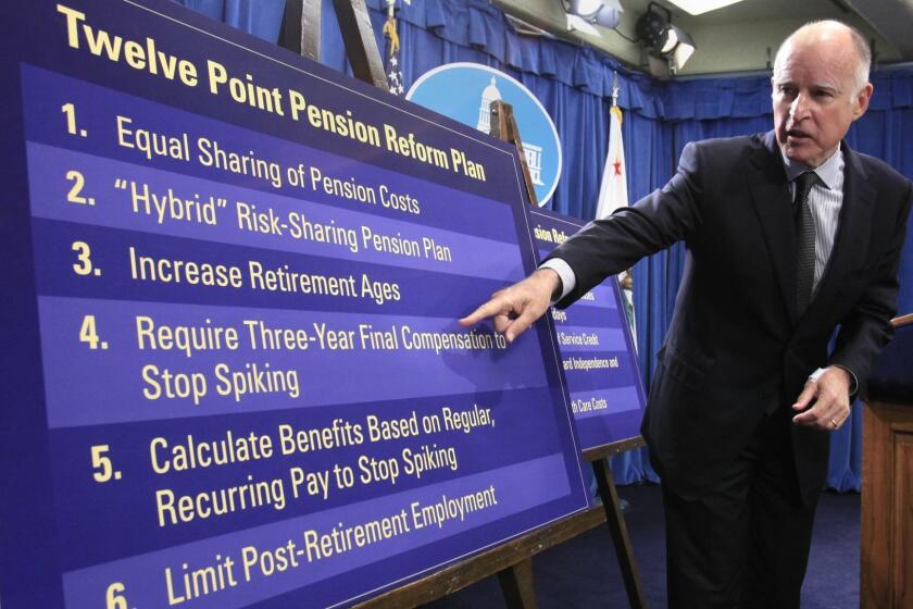 FILE -- In this Oct. 27, 2011 file photo, Gov. Jerry Brown gestures to a chart showing some of his proposals to rollback public employee pension benefits during a news conference at the Capitol in Sacramento, Calif. The non-partisian Legislative Analyst's office released it's report on Brown's plan Tuesday, calling it a 'bold, excellent starting point" for controlling the high cost of retirement benefits.(AP Photo/Rich Pedroncelli, file)