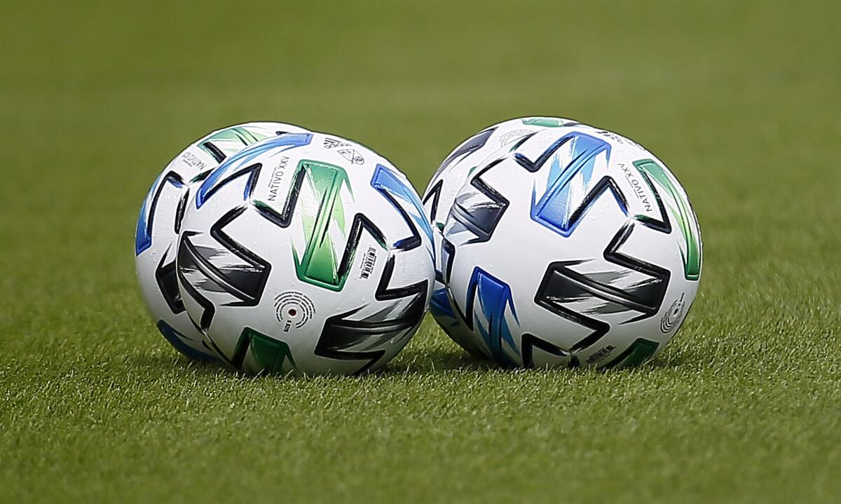 Two soccer balls on the field before the Los Angeles Galaxy plays the Houston Dynamo 