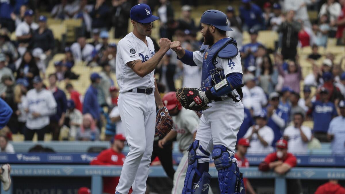 Dodgers catcher Russell Martin congratulates Joe Kelly after a scoreless ninth inning on June 2.