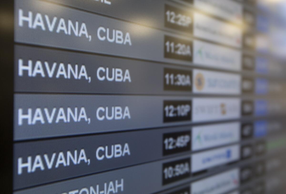 Charter flights from Miami to Havana are shown on a departures monitor at Miami International Airport, Friday, Jan. 16, 2015 in Miami. U.S. and Cuban officials are scheduled to meet to discuss operating regular commercial flights between the countries.
