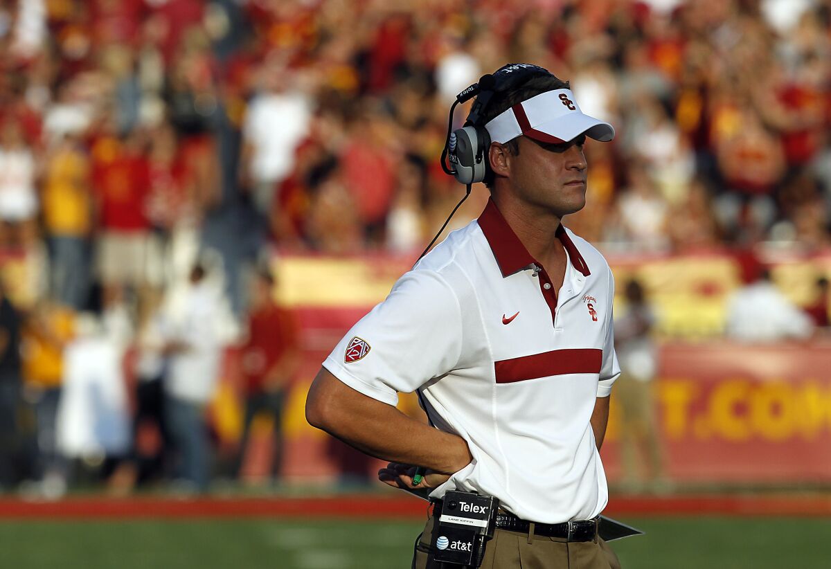 USC coach Lane Kiffin watches the Trojans play Syracuse at the Coliseum on Sept. 17, 2011.