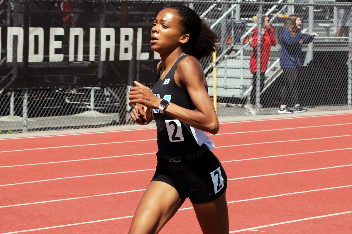 Corona del Mar's Melisse Djomby-Enyawe competes in the 1,600 meters at the Orange County track and field championships.