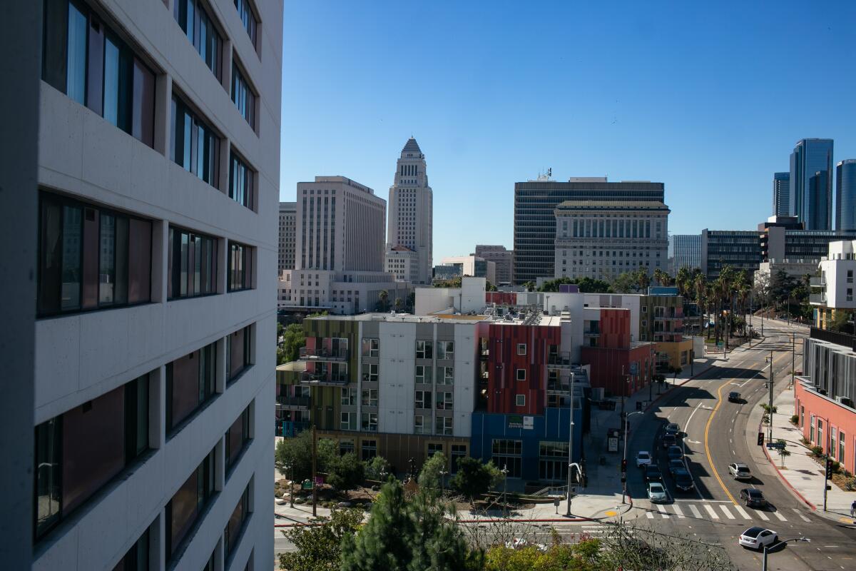A view of Los Angeles City Hall from inside the Cathay Manor Apartments building in Chinatown.