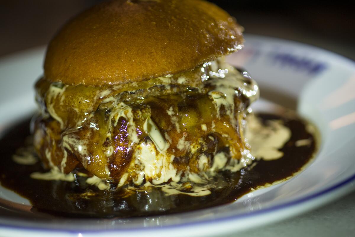 Chef April Bloomfield ordered the Bic Mec burger during her Burger Crawl stop at Petit Trois. (Gina Ferazzi / Los Angeles Times)