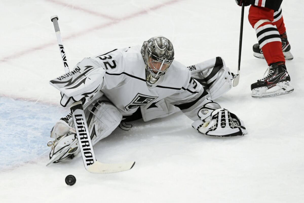 Los Angeles Kings goaltender Jonathan Quick makes a save during the third period of the team's NHL hockey game against the Chicago Blackhawks on Tuesday, April 12, 2022, in Chicago. (AP Photo/Paul Beaty)
