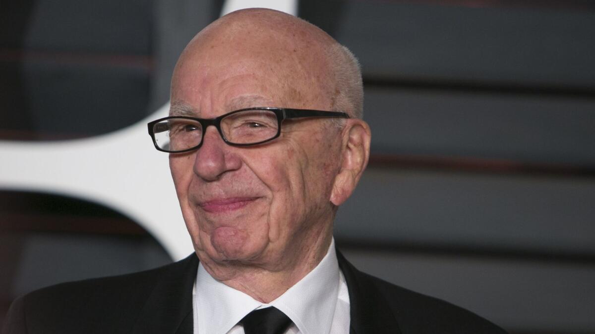 21st Century Fox Executive Chairman Rupert Murdoch arrives at the 2015 Vanity Fair Oscar party in Beverly Hills.