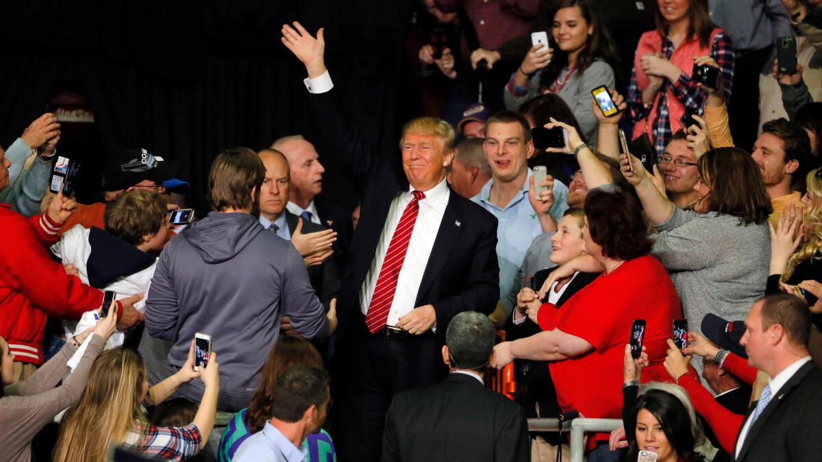 Republican presidential candidate Donald Trump waves to supporters during a campaign stop in Little Rock, Ark. on Feb. 3.