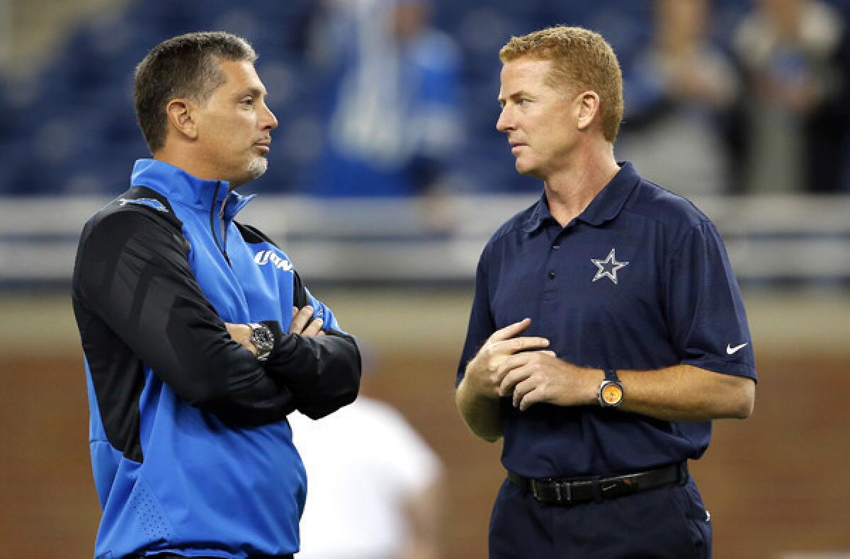 Coaches Jim Schwartz of the Lions and Jason Garrett of the Cowboys chat before their game earlier this season.