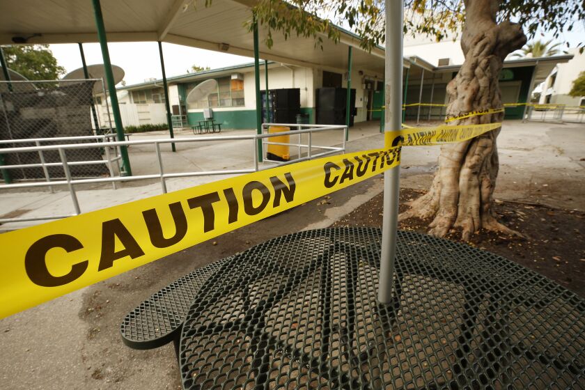LOS ANGELES, CA - MARCH 18, 2020 Common areas at Dorsey High School, 3537 Farmdale Ave are cordoned off with caution tape in Los Angeles Wednesday morning. (Al Seib / Los Angeles Times)