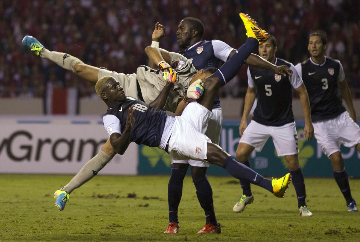 U.S. forward Eddie Johnson, front, collides with Costa Rica goalkeeper Keylor Navas, who blocked Johnson's attempt to score during USA's 3-1 loss Friday.