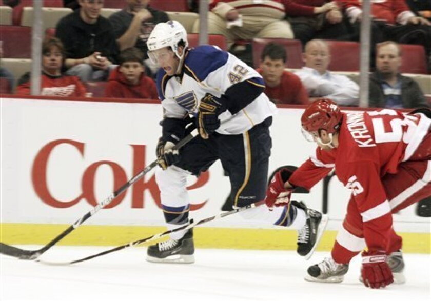 St. Louis Blues' David Backes (42) tries to get past Detroit Red Wings' Niklas Kronwall, from Sweden, during the first period of an NHL hockey game on Thursday, April 2, 2009, in Detroit. (AP Photo/Jerry S. Mendoza)
