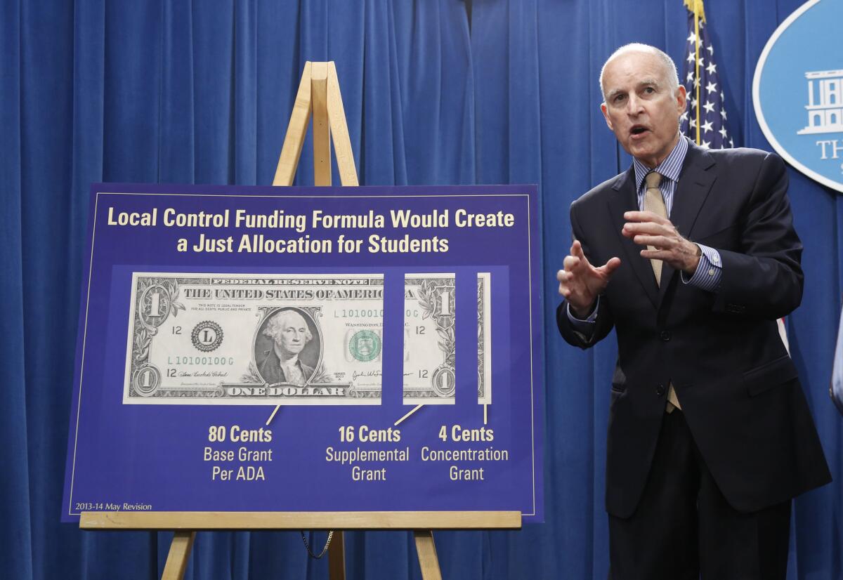 Gov. Jerry Brown responds to a question concerning his plan to give more local control over education funding as he discussed his revised 2013-14 state budget plan at the Capitol.