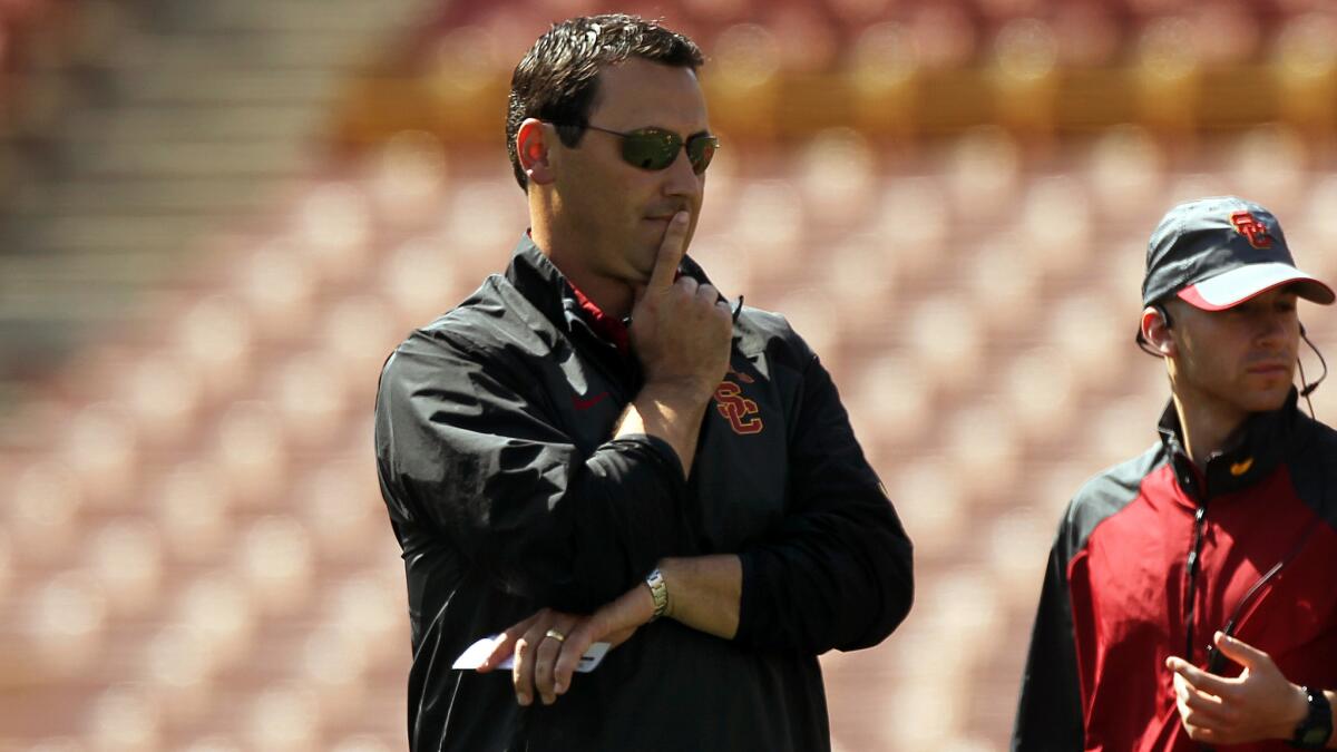 USC Coach Steve Sarkisian looks on during the team's 2014 spring game at the Coliseum.