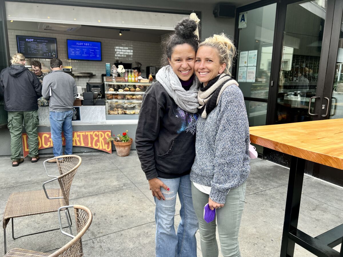 Gloria Serna and Amanda Morrow stand at the temporary location of their Flower Pot Cafe and Bakery at The Lot in La Jolla.