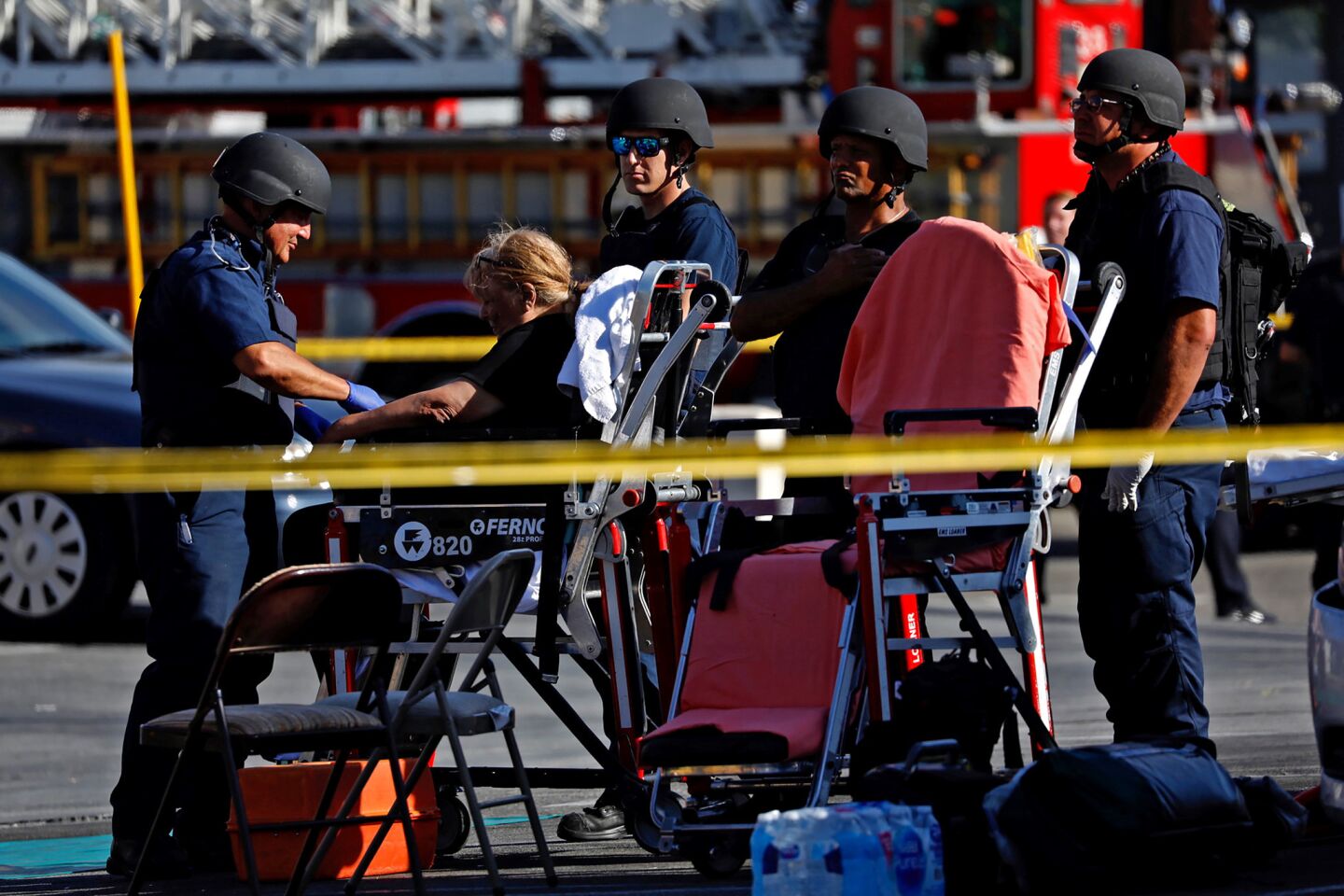 A woman is evacuated on a gurney outside the Silver Lake Trader Joe's where a gunman held hostages for several hours.