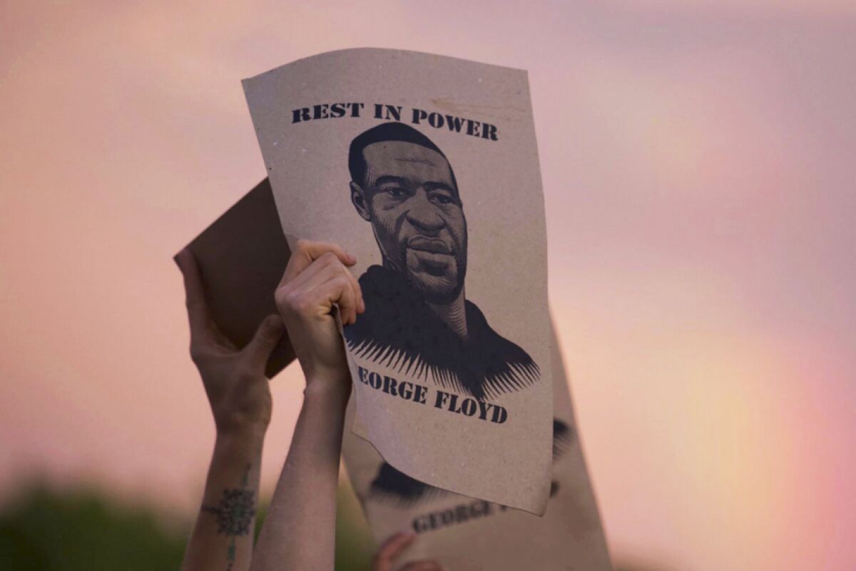 A sign at a protest in Minneapolis reads, "Rest in power George Floyd"