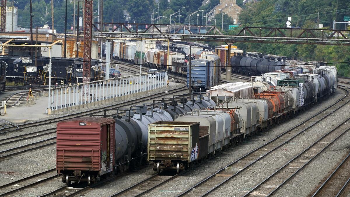 FILE - Freight cars wait to be hauled out of the Norfolk Southern Conway Terminal in Conway, Pa., Sept. 15, 2022. The possibility of an economically devastating railroad strike has been pushed back into early December to allow time for engineers and conductors to vote on their agreements with the freight railroads and give more opportunity for the industry to renegotiate with two unions that rejected their deals last month. (AP Photo/Gene J. Puskar, File)