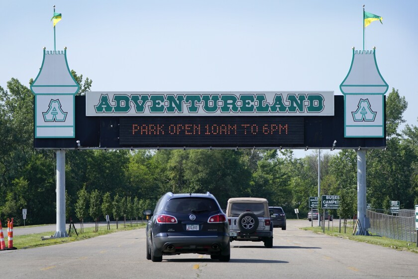 FILE - Visitors arrive at the Adventureland Park amusement park, Tuesday, July 6, 2021, in Altoona, Iowa. The family of an 11-year old boy who died on a water ride at an Iowa amusement park a year ago filed a wrongful death lawsuit in state court Thursday, June 30, 2022, alleging the park failed to properly maintain and repair its rides. David and Sabrina Jaramillo, of Cedar Rapids and three of their children David Jaramillo Jr., August Jaramillo and Nyla Pettie filed the lawsuit against Adventureland Park in the Des Moines, Iowa, suburb of Altoona. (AP Photo/Charlie Neibergall, File)